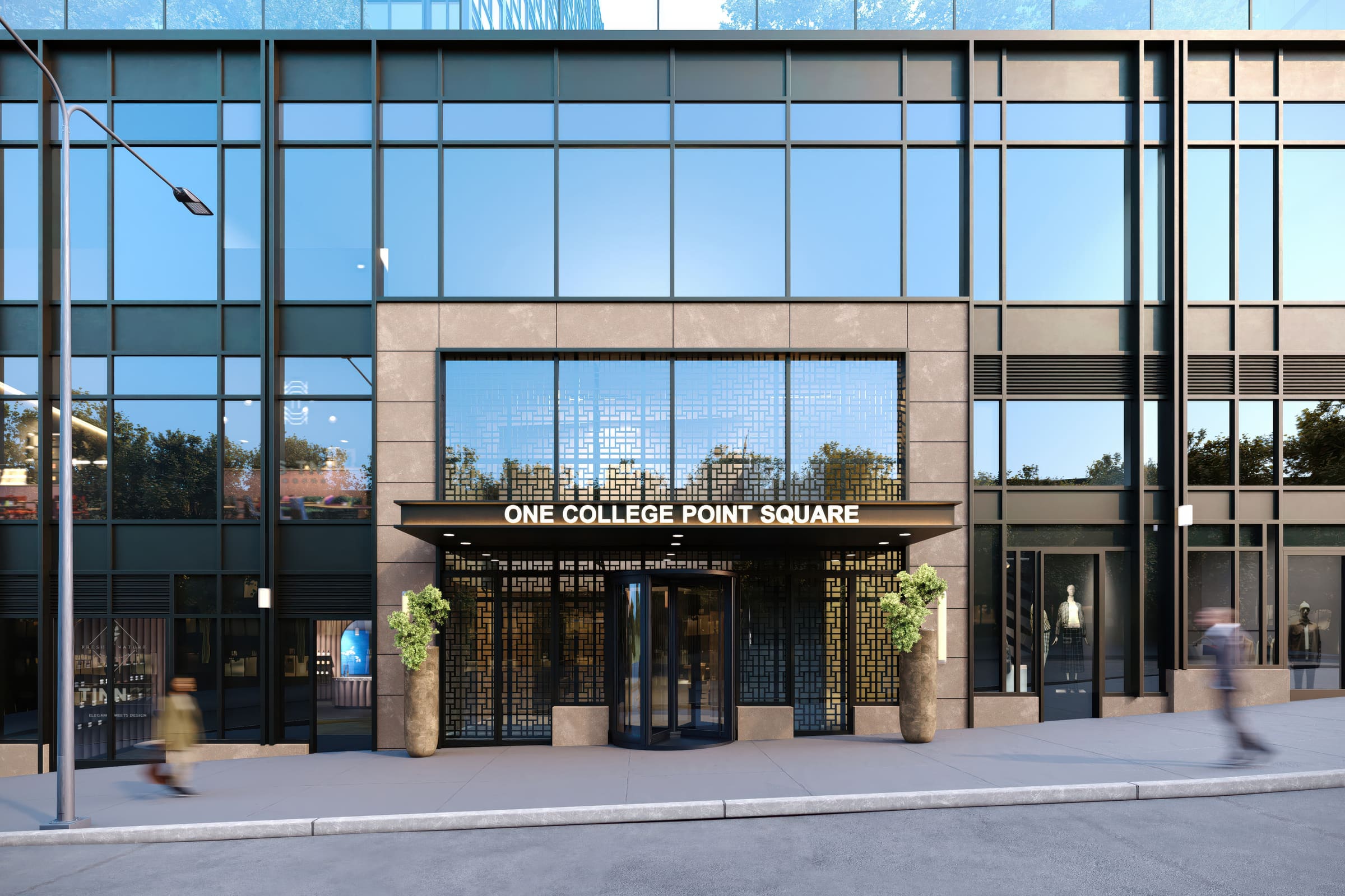 The stone-and-glass entrance of One College Point Square with its lattice screen canopy