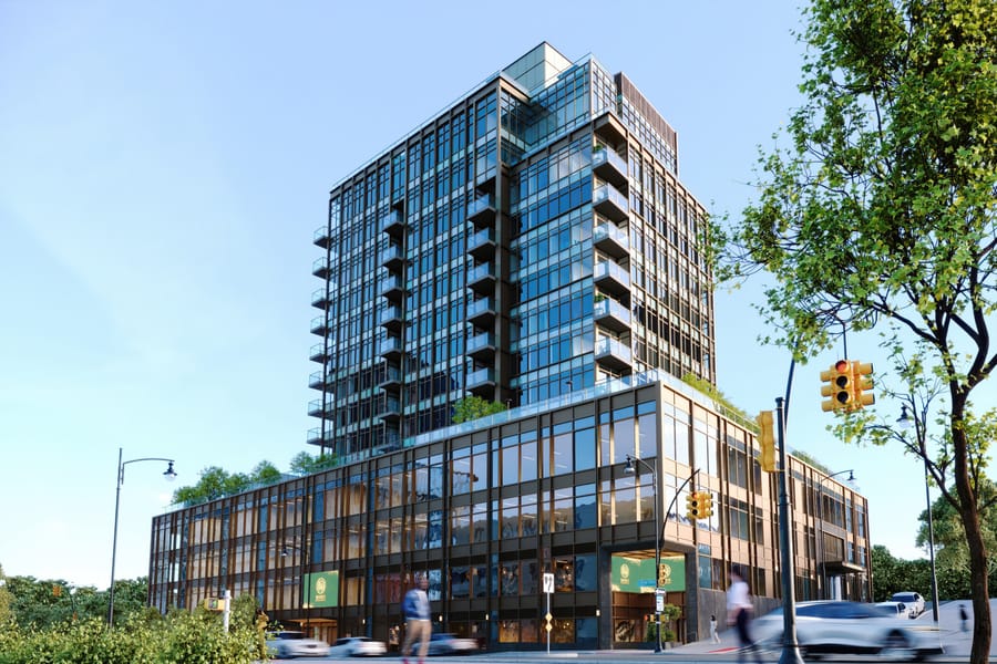 The bronze-and-glass tower of One College Point Square on its corner site