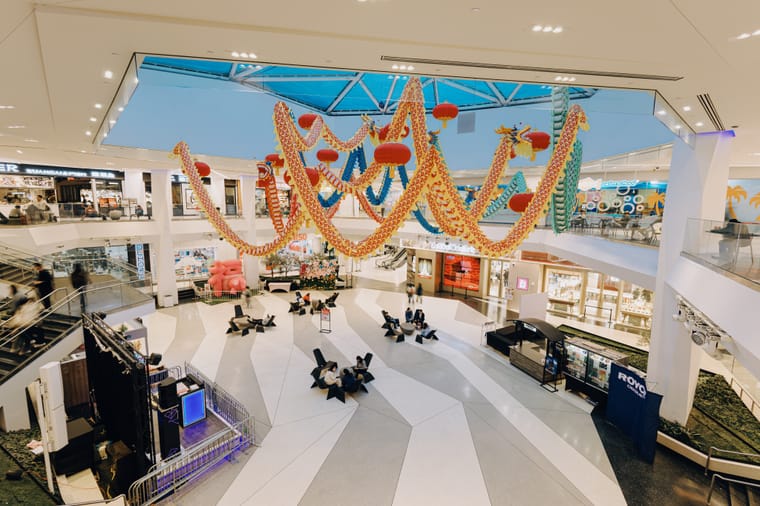 The bright atrium of a modern shopping mall