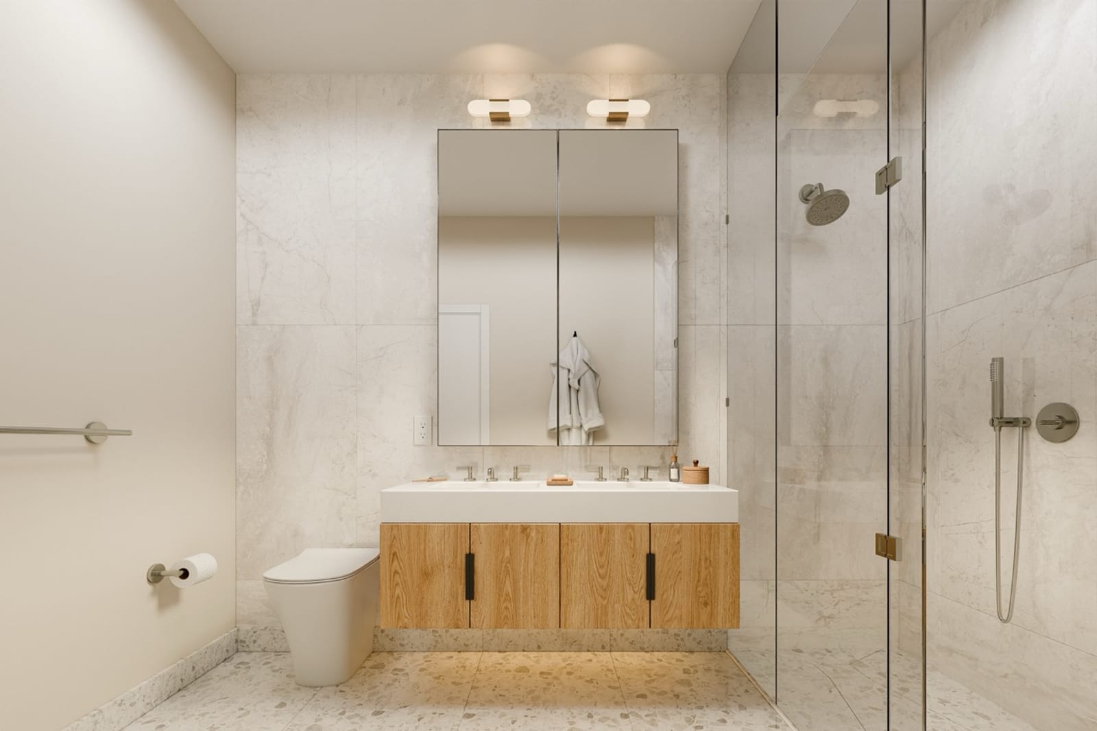 A penthouse bathroom with a double vanity, twin medicine-cabinet mirrors, light oak cabinetry, honed marble walls, and a glass-enclosed walk-in shower