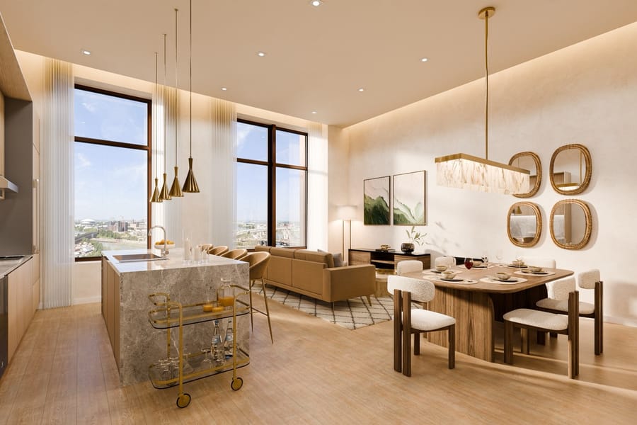 A sunlit residence interior with open kitchen, dining, and living areas
