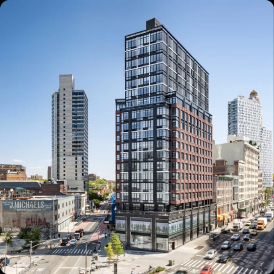 A Hill West Architects residential high-rise rising above a Long Island City street