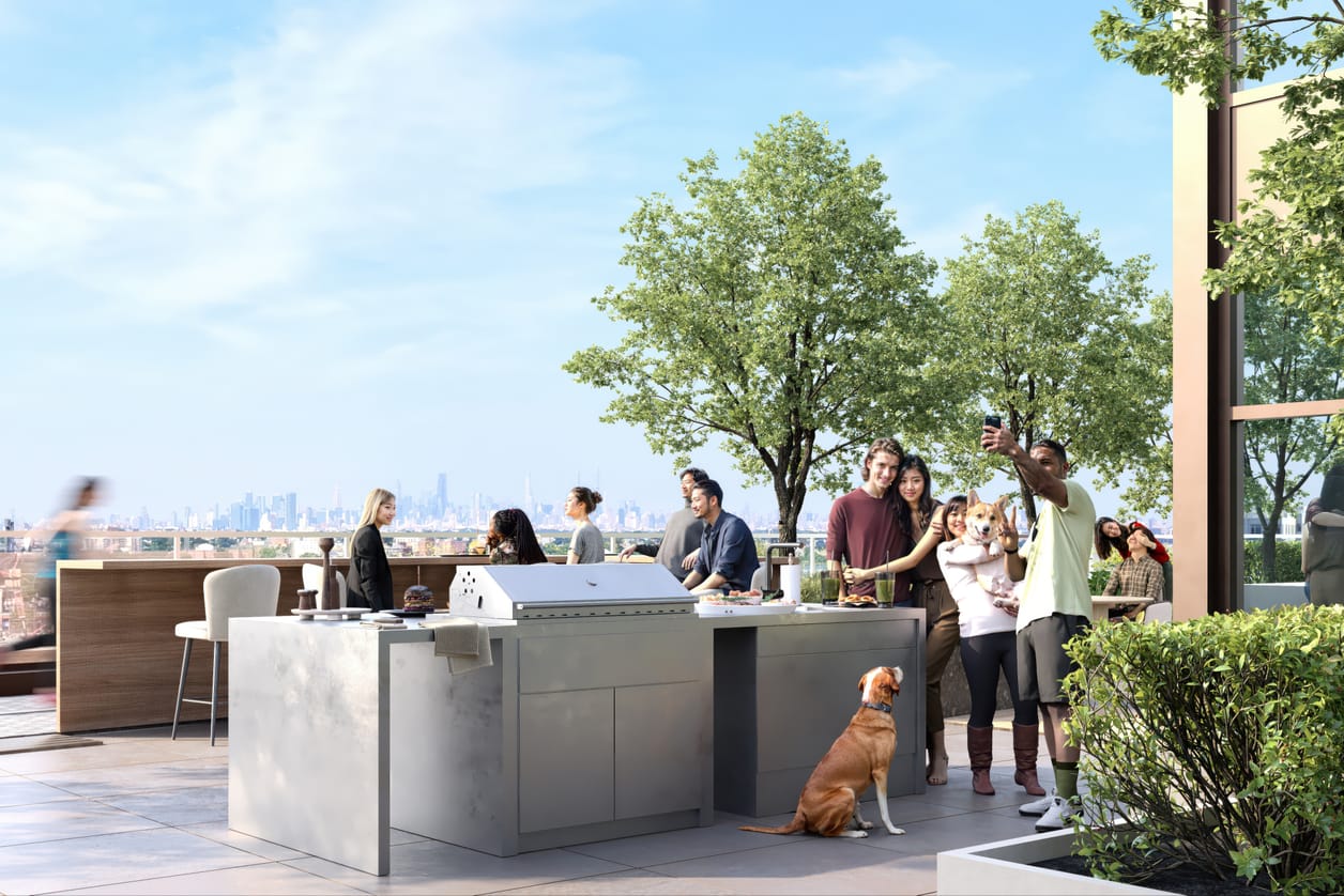 A rooftop barbecue terrace with built-in grills, dining tables, and a skyline view
